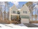 Beautiful two-story home with covered porch, a welcoming front entrance and attached garage at 2209 Woodnell Dr, Raleigh, NC 27603