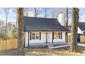 Renovated bungalow style home with a new roof and a gray front porch at 2908 Basswood Dr, Raleigh, NC 27610