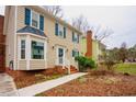 Charming two-story home with a well-manicured front yard and inviting curb appeal at 3320 Derbyshire Pl, Raleigh, NC 27604