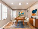 Tastefully decorated dining room featuring a modern table, chairs, and stylish artwork at 4704 Upchurch Ln, Wake Forest, NC 27587