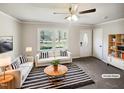 Bright living room with neutral decor, a large window, stylish furniture, and ample natural light at 5614 Greenbay Dr, Durham, NC 27712