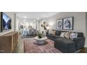 Open concept living room and dining area perfect for entertaining, offering comfort and style at 1305 White Verona Way, Knightdale, NC 27545