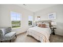 Cozy bedroom with natural light, plush carpeting, and a comfortable upholstered headboard at 149 Cribbs Ln, Middlesex, NC 27557