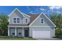 Charming two-story home with blue siding, a two-car garage, and a well-maintained front yard with flower beds at 149 Cribbs Ln, Middlesex, NC 27557