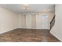Spacious living room featuring hardwood floors, natural light, and staircase at 155 Jade St, Smithfield, NC 27577