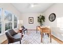 Cozy office space with neutral tones, a ceiling fan, and a large window for natural light at 203 Preston Oaks Ln, Cary, NC 27513