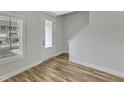 Entryway featuring a light-filled space with hardwood floors and staircase access at 204 Jetson Creek Way, Youngsville, NC 27596
