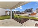 Street view showcasing the new home community's well maintained landscaping at 204 Jetson Creek Way, Youngsville, NC 27596