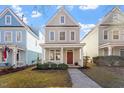 Attractive two-story house with a covered front porch and manicured lawn at 4511 All Points View Way, Raleigh, NC 27614