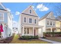 Attractive two-story house featuring a cozy front porch and tidy landscaping at 4511 All Points View Way, Raleigh, NC 27614