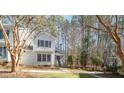 Inviting two-story home with a well-maintained lawn and picturesque landscaping at 577 Woodbury, Pittsboro, NC 27312