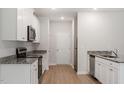 Well-lit kitchen featuring granite countertops and stainless steel appliances at 815 Rhino Bnd, Oxford, NC 27565