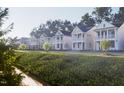 Attractive street view of homes showcasing various exterior designs and landscaping at 308 White Oak Garden Way # 215, Garner, NC 27529
