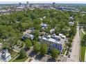 Charming aerial view of the apartment complex nestled amongst a canopy of trees in a quiet neighborhood at 312 N Buchanan Blvd # 302, Durham, NC 27701