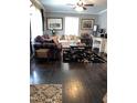 Cozy living room with hardwood floors, patterned sofas, and a decorative rug at 3607 Buffaloe Rd, Raleigh, NC 27604