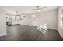 Inviting living room open to the kitchen featuring hardwood floors and neutral walls at 3639 Nc Highway 39, Selma, NC 27576