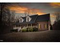 Beautiful brick home features a spacious porch and well-manicured landscaping at 4639 Reid Rd, Elon, NC 27244