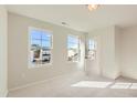 Bright and airy bedroom with neutral carpet, three windows, and a convenient doorway at 484 Barnes Landing Dr, Four Oaks, NC 27524