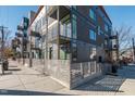 Exterior corner view showcasing modern architecture, balconies, and a sleek fence design at 521 N Mangum St # 33, Durham, NC 27701