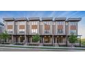 Attractive exterior row of townhomes showcasing a modern design with stylish brick, wood, and metal elements at 777 Willard St, Durham, NC 27701