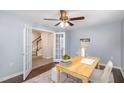Cozy home office with natural light, neutral tones, french doors, and space for productivity at 113 Callowhill Ln, Durham, NC 27713