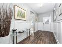 Welcoming entryway with stylish decor, featuring a glass table and elegant wall art at 117 Blue Hydrangea Ln, Holly Springs, NC 27540