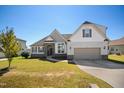 Charming home with a well-manicured lawn and a welcoming two-car garage at 156 Bornean Dr, Garner, NC 27529