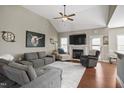 Cozy living room featuring a fireplace, high ceiling, and ample seating at 156 Bornean Dr, Garner, NC 27529