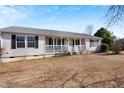 Charming single-story house with a welcoming front porch and well-maintained yard at 186 Sunrise Dr, Sanford, NC 27332