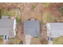 Aerial view of home showing roof, yard, nearby houses and neighborhood at 2114 Frissell Ave, Apex, NC 27502