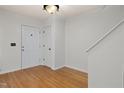 Bright entryway with hardwood floors, fresh paint, and white doors at 2114 Frissell Ave, Apex, NC 27502