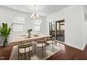 Bright dining room featuring hardwood floors, natural light, and access to the screened porch at 2117 Mckenzie Ridge Lane Ln, Apex, NC 27502
