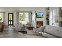Cozy living room with fireplace, built-in shelving, and neutral-toned furniture at 2656 Welham Aly, Raleigh, NC 27608