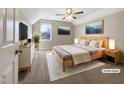 Bedroom with soft carpet, light colored walls, ceiling fan, and natural light at 308 Trimble Ave, Cary, NC 27511
