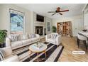 Bright living room featuring a fireplace, hardwood floors, and neutral decor, virtually staged for inspiration at 308 Trimble Ave, Cary, NC 27511