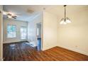 Bright dining room showcasing hardwood floors, fresh paint, modern ceiling fan, and lots of natural light at 4120 Standing Rock Way, Raleigh, NC 27604