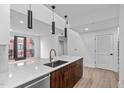 Modern kitchen island with a sink and plenty of counter space at 615 W Peace St # 406, Raleigh, NC 27605