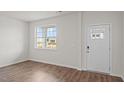 Cozy room with a large window and nearby front door at 6453 Alfalfa Ln, Wake Forest, NC 27587