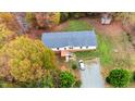 Aerial view of home and lot showing the large parcel, long driveway, and a peek at fall foliage at 6508 Treetop Ct, Snow Camp, NC 27349