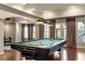Game room featuring a well-lit billiard table and access to the outdoors at 803 Landuff Ct, Cary, NC 27519