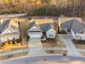 An aerial shot showing the property's location in a neighborhood with well-maintained yards and mature trees at 924 Calista Dr, Wake Forest, NC 27587