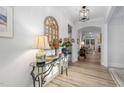 Bright entryway featuring stylish decor, a glass table with decorative items, and an open view into the living spaces at 924 Calista Dr, Wake Forest, NC 27587