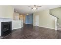 Open-concept living area with fireplace and hardwood floors at 1009 Laceflower Dr, Durham, NC 27713