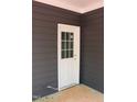 Close up of the home's back door showing the color scheme and construction details at 105 Sherwood Ln, Hillsborough, NC 27278