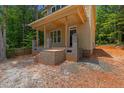 Close up of the front porch with brick foundation at 105 Sherwood Ln, Hillsborough, NC 27278