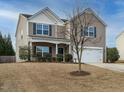 Beautiful two-story home with a well-maintained lawn and attached two-car garage at 1113 Crendall Way, Wake Forest, NC 27587