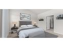 Bright bedroom with neutral walls, a large window, and stylish furnishings at 160 Scenic Rock Dr, Youngsville, NC 27596