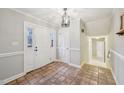 Entryway with tiled floor, chandelier, and white trim at 200 Beachers Brook Ln, Cary, NC 27511