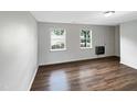Spacious living area featuring sleek flooring, natural light, and neutral paint at 26 Malbry Pl, Durham, NC 27704