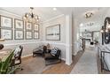 Modern home office featuring stylish decor, lighting and hardwood flooring at 2644 Catheys Creek Cir, Wendell, NC 27591